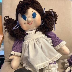 Large doll with purple dress.
